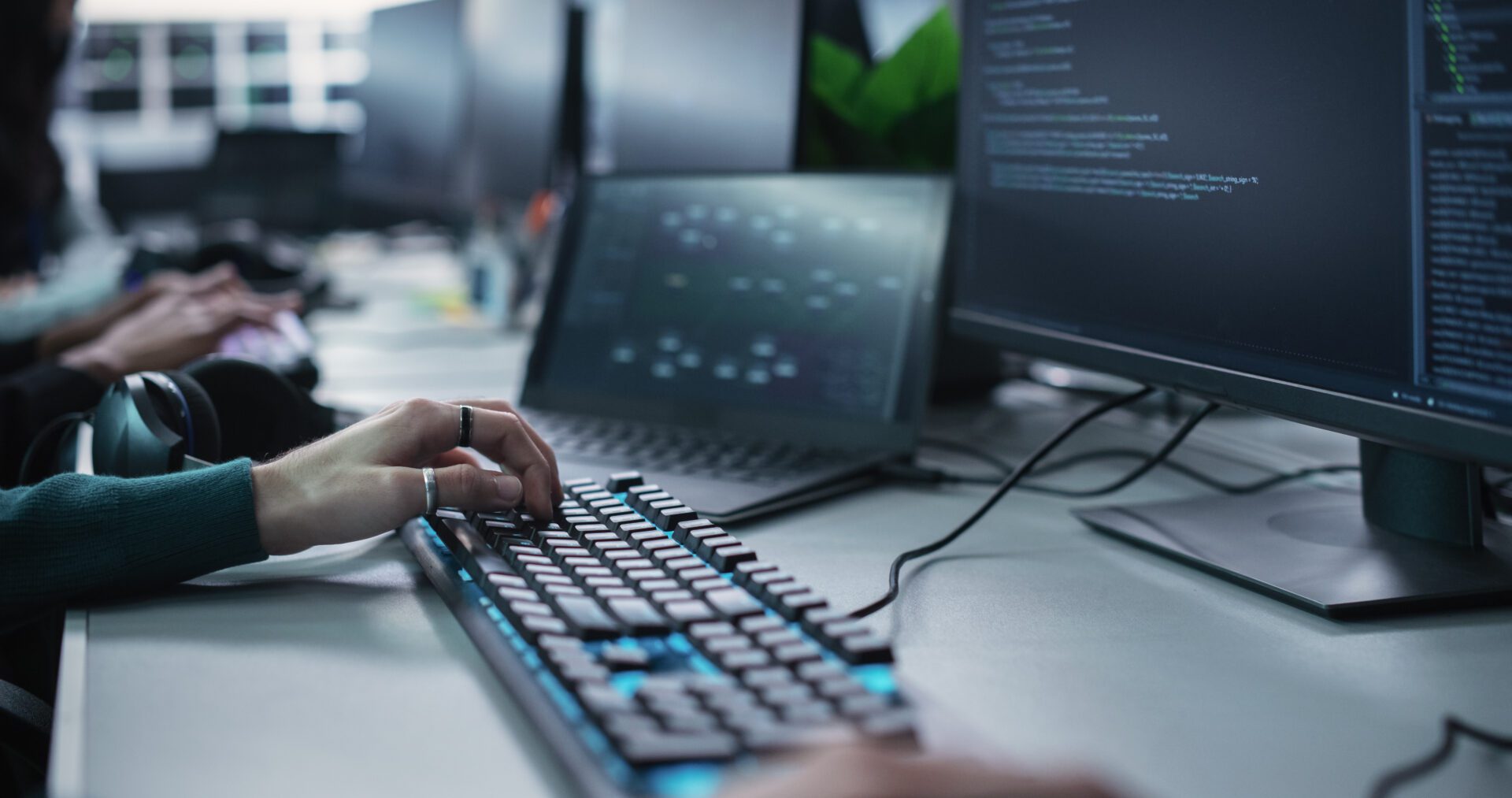 Close Up of a Software Developer Working on a Desktop Computer, Implementing New Features and Updates to a Company Server. Stylish Specialist Wearing Rings and Bracelet